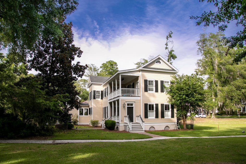Professional Exterior Cleaners Serving The Villages & Beyond Beautiful two story home with manicured lawn and garden.